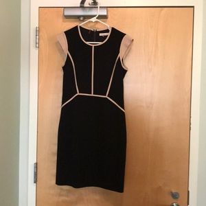 Black dress with beige piping